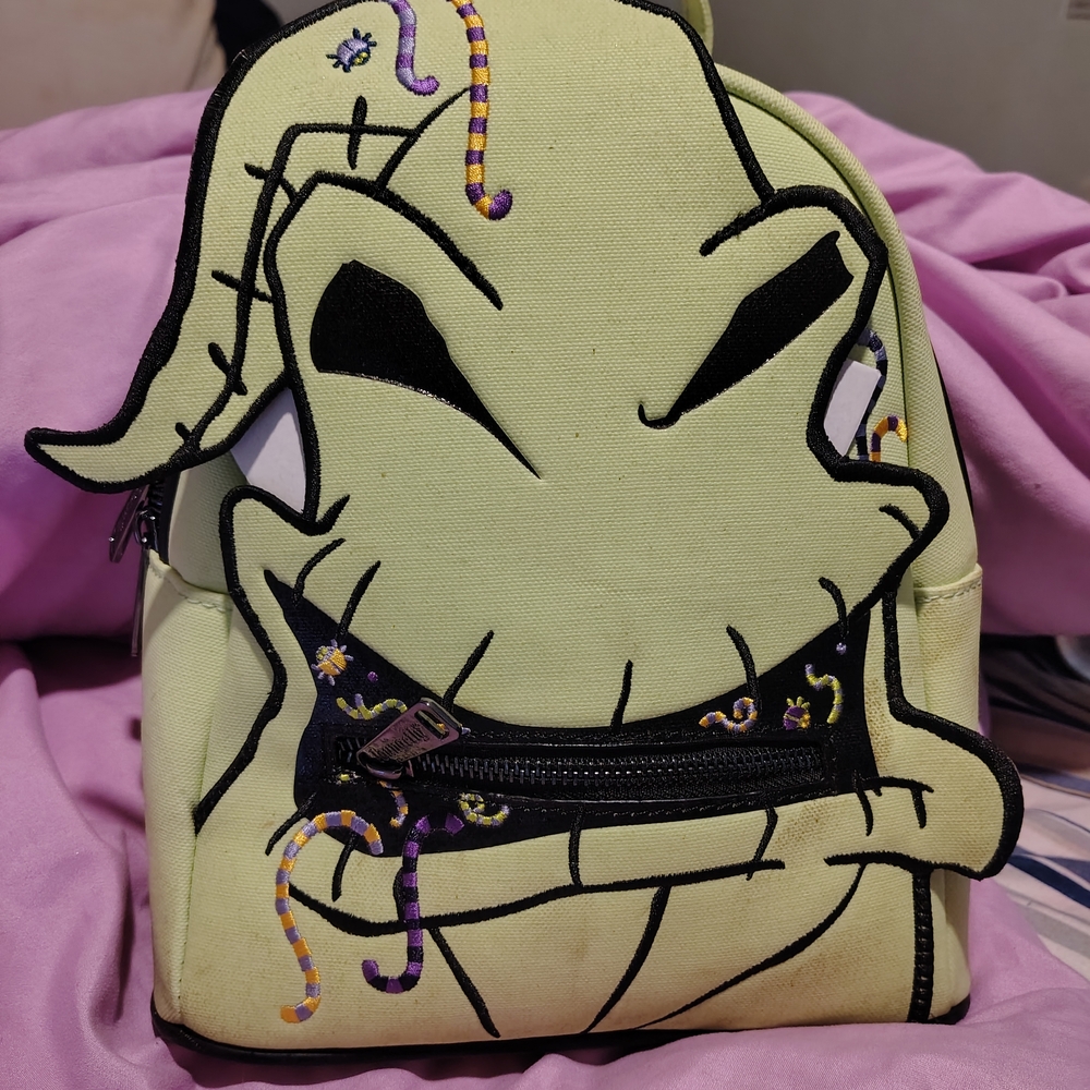 Stylish Cream Backpack with Embroidered Design